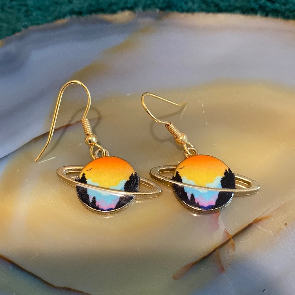 Saturn dangling earrings